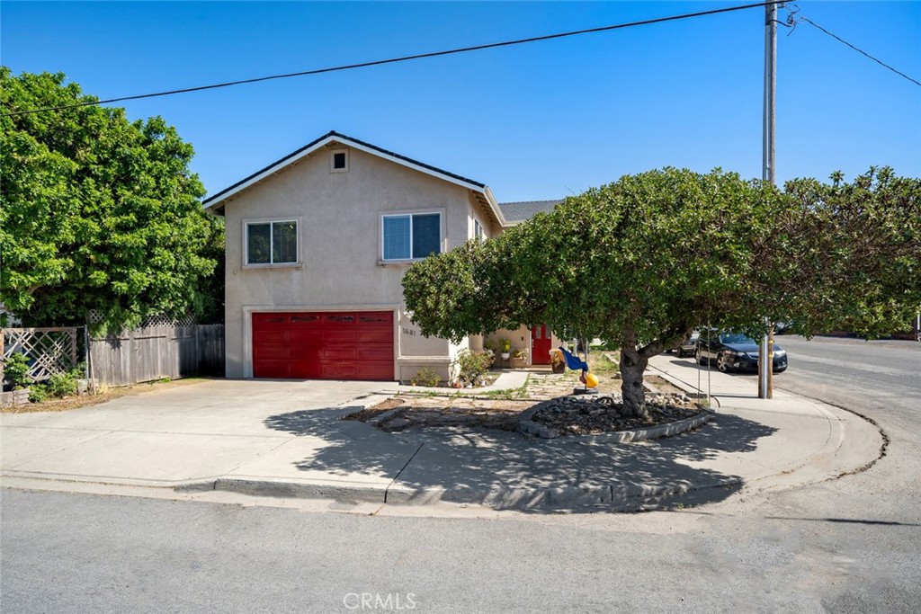 1681 Ocean Street Oceano, CA 93445 - Photo 2 of 25 a backyard of a house with yard and outdoor seating