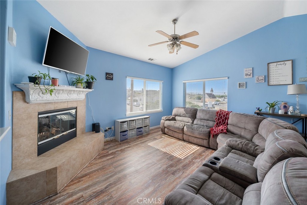 1681 Ocean Street Oceano, CA 93445 - Photo 4 of 25 a living room with furniture a flat screen tv and a fireplace