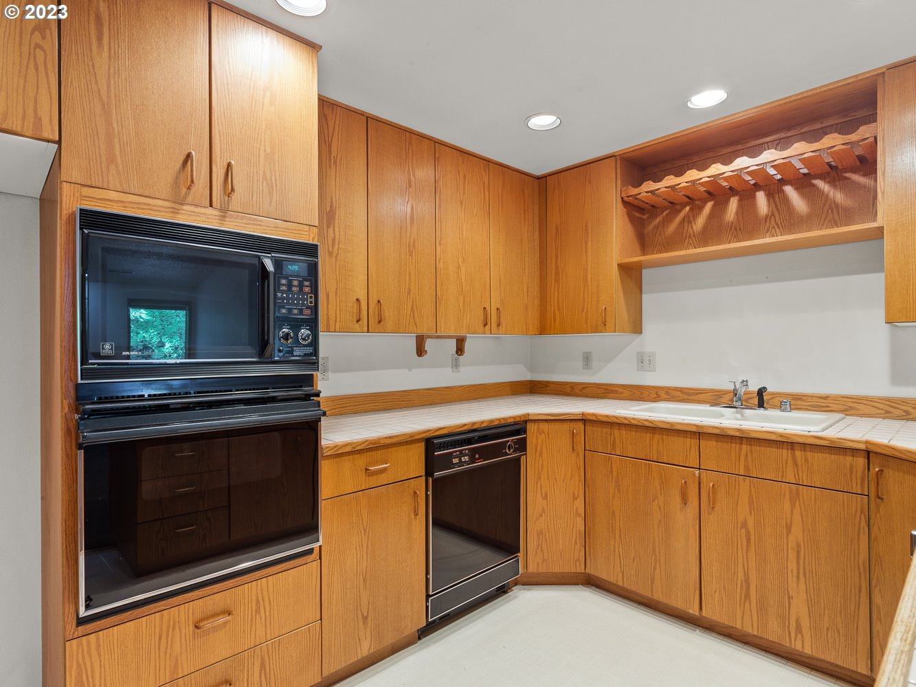 3300 Northeast 164th Street, Unit R2 Ridgefield, WA 98642 - Photo 17 of 37 a kitchen with granite countertop stainless steel appliances a stove sink and cabinets