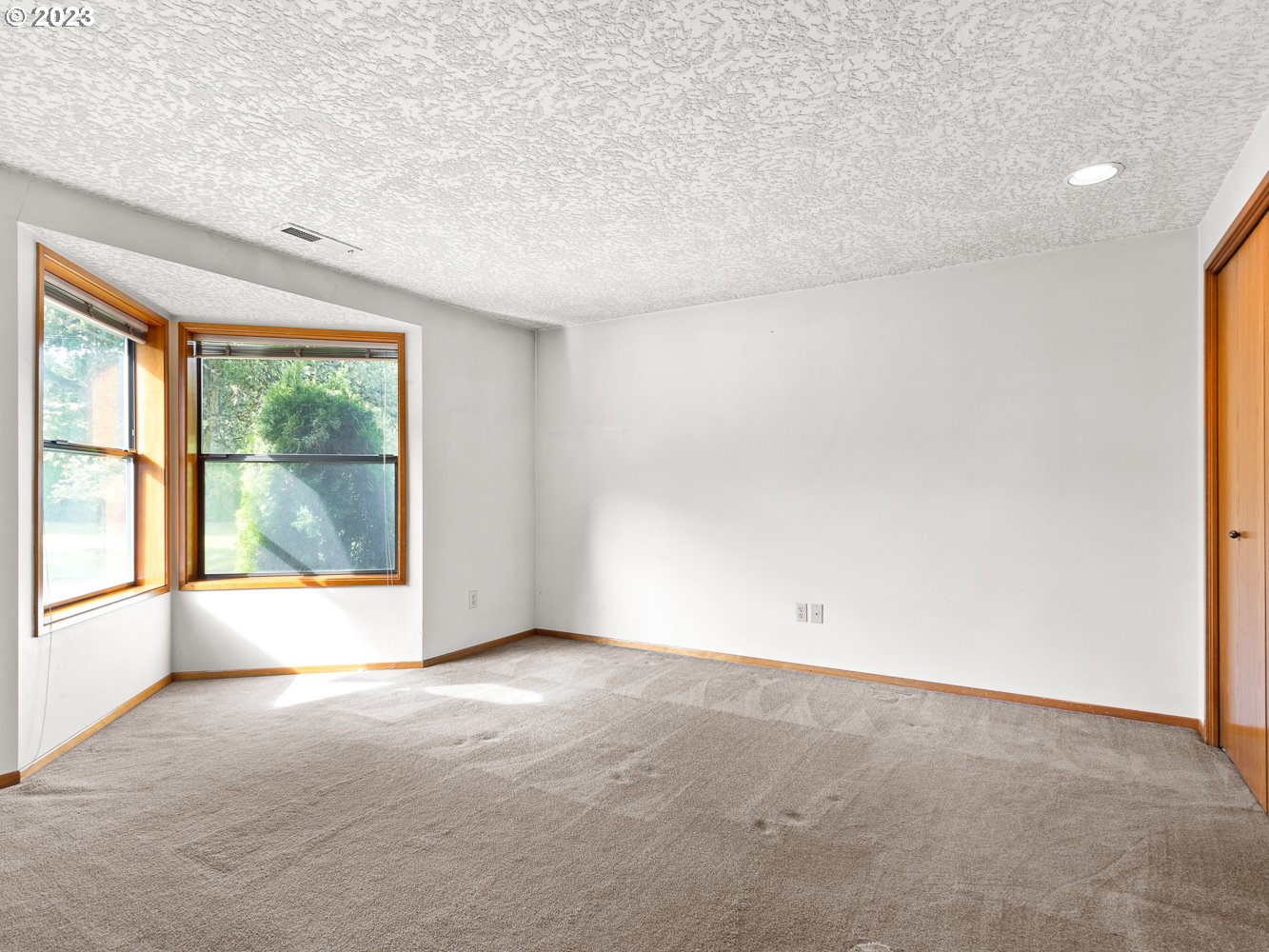 3300 Northeast 164th Street, Unit R2 Ridgefield, WA 98642 - Photo 5 of 37 an empty room with a window