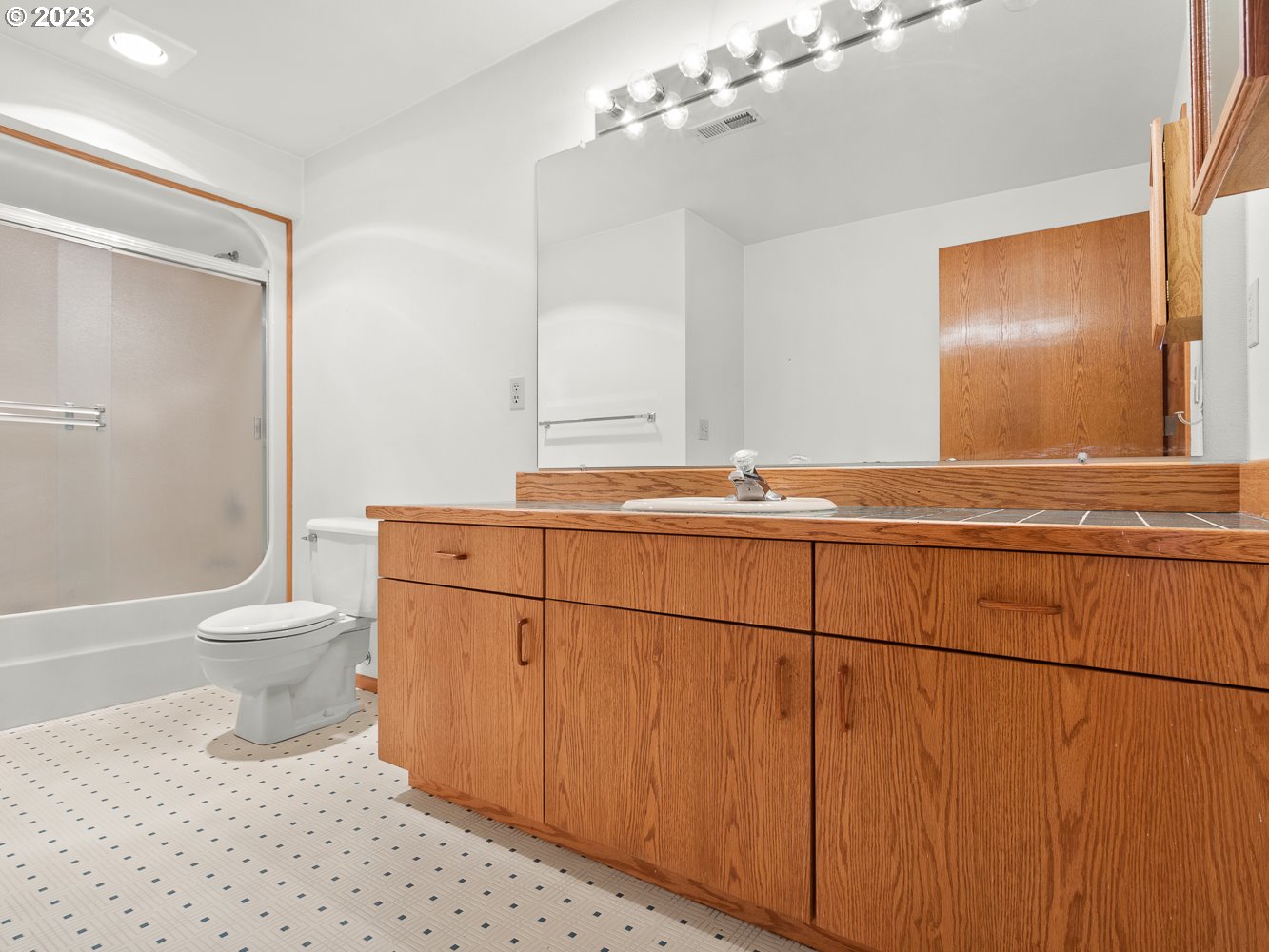 3300 Northeast 164th Street, Unit R2 Ridgefield, WA 98642 - Photo 7 of 37 a bathroom with a sink a toilet and shower