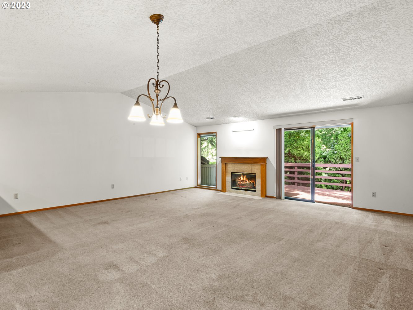 3300 Northeast 164th Street, Unit R2 Ridgefield, WA 98642 - Photo 8 of 37 a view of empty room with furniture and fireplace
