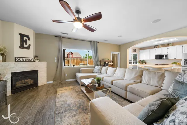 a living room with furniture and a fireplace