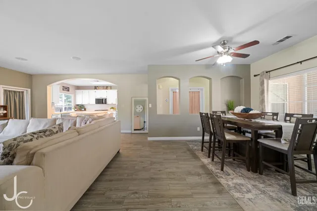 a view of a dining room with furniture and a livingroom