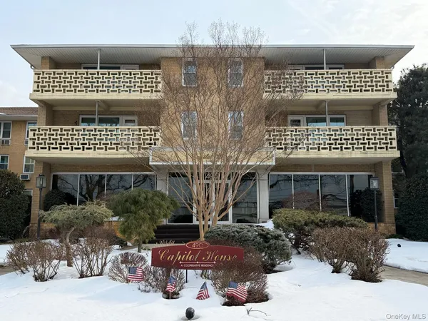 a front view of a house with a large window