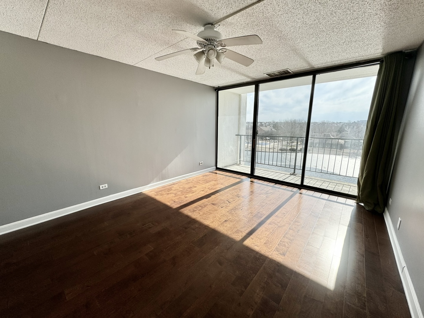 2015 South Finley Road, Unit 407 Lombard, IL 60148 - Photo 12 of 23 wooden floor in an empty room with a window