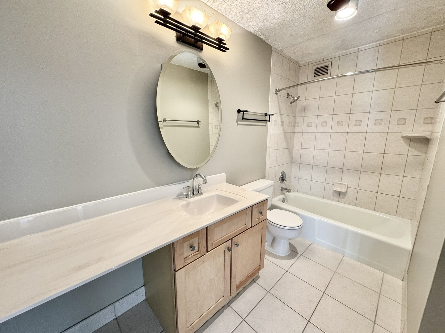2015 South Finley Road, Unit 407 Lombard, IL 60148 - Photo 14 of 23 a bathroom with a double vanity sink toilet mirror and shower
