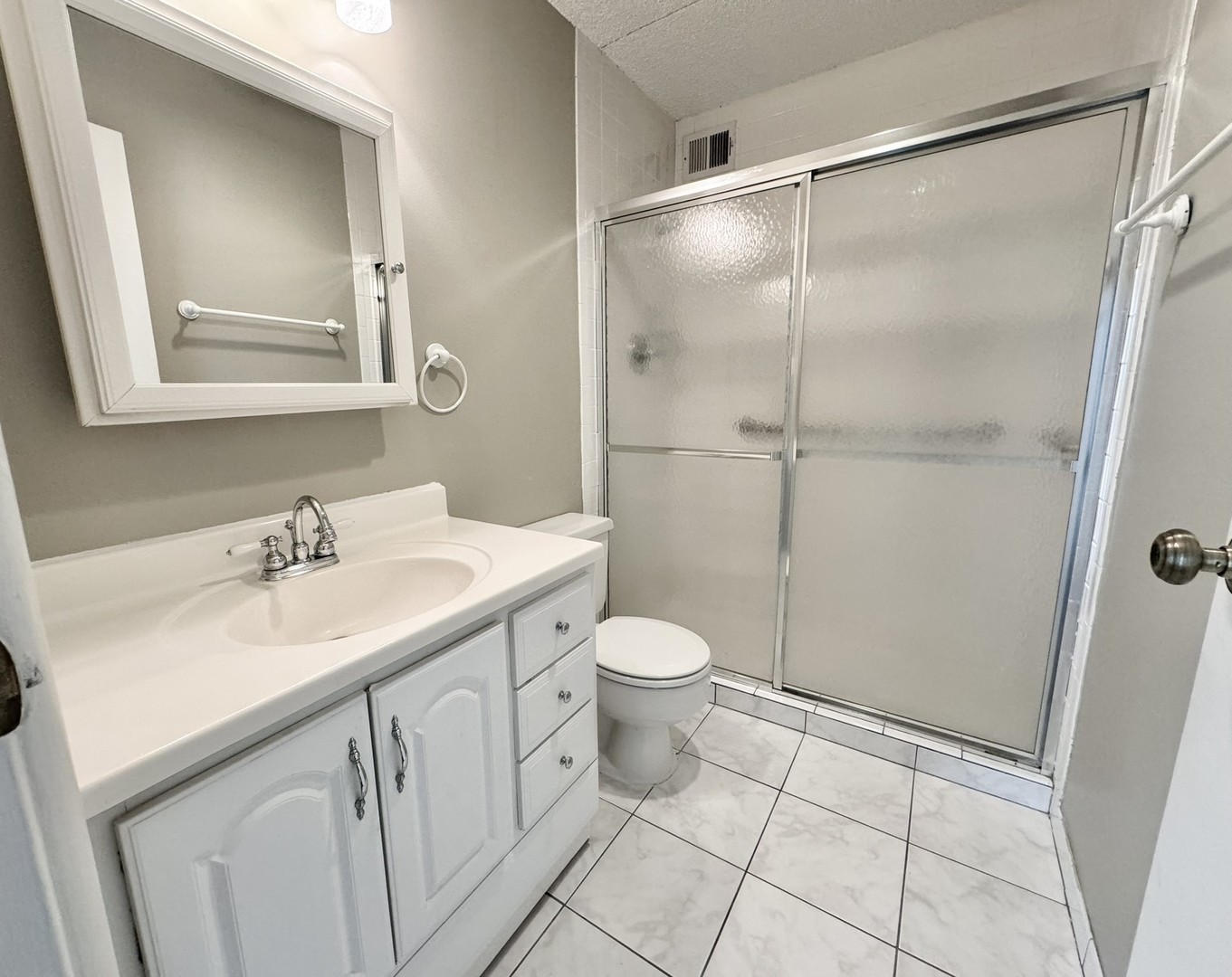 2015 South Finley Road, Unit 407 Lombard, IL 60148 - Photo 16 of 23 a bathroom with a sink toilet and shower