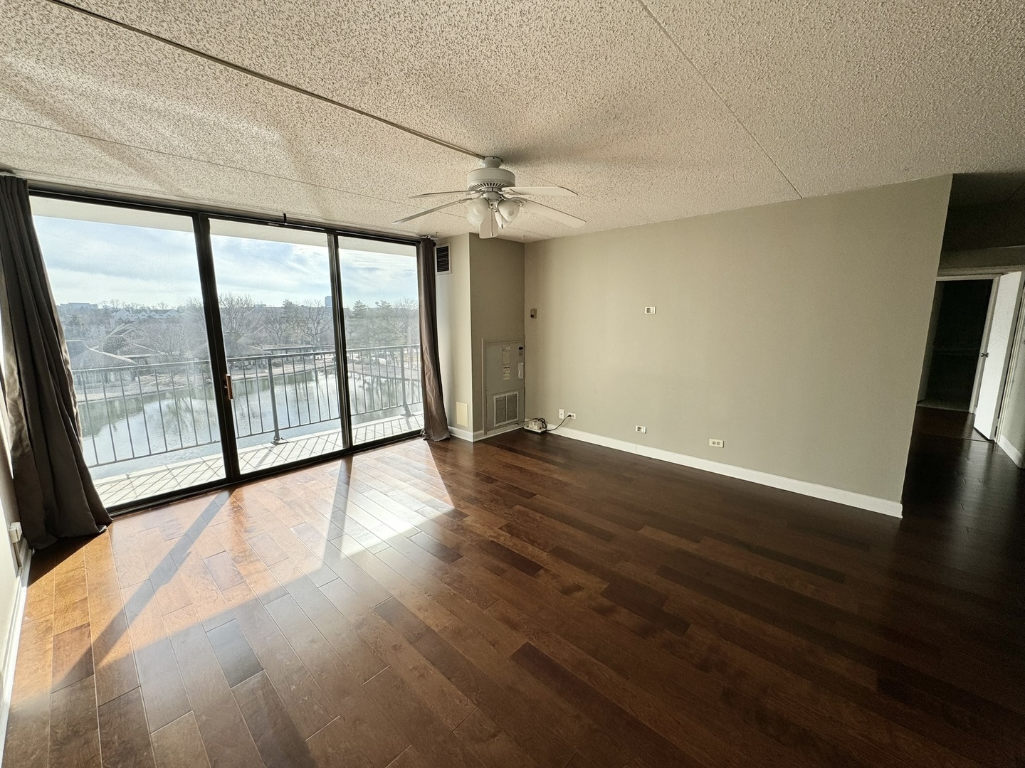 2015 South Finley Road, Unit 407 Lombard, IL 60148 - Photo 6 of 23 wooden floor in an empty room with a window