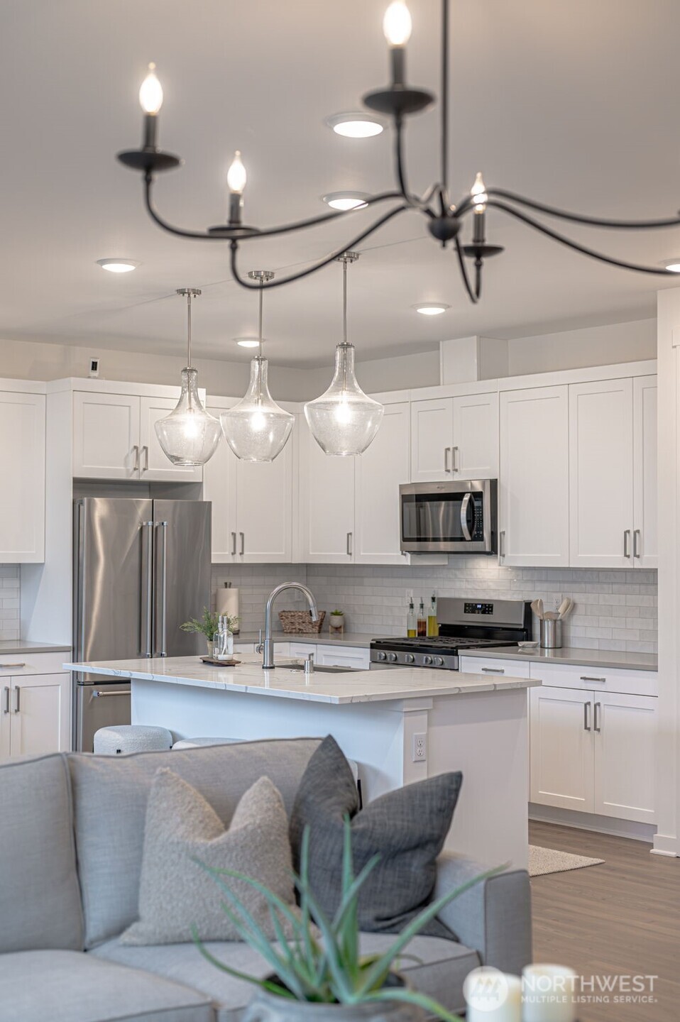 20709 137th Street Southeast Monroe, WA 98272 - Photo 11 of 40 a kitchen with stainless steel appliances granite countertop a sink and a refrigerator