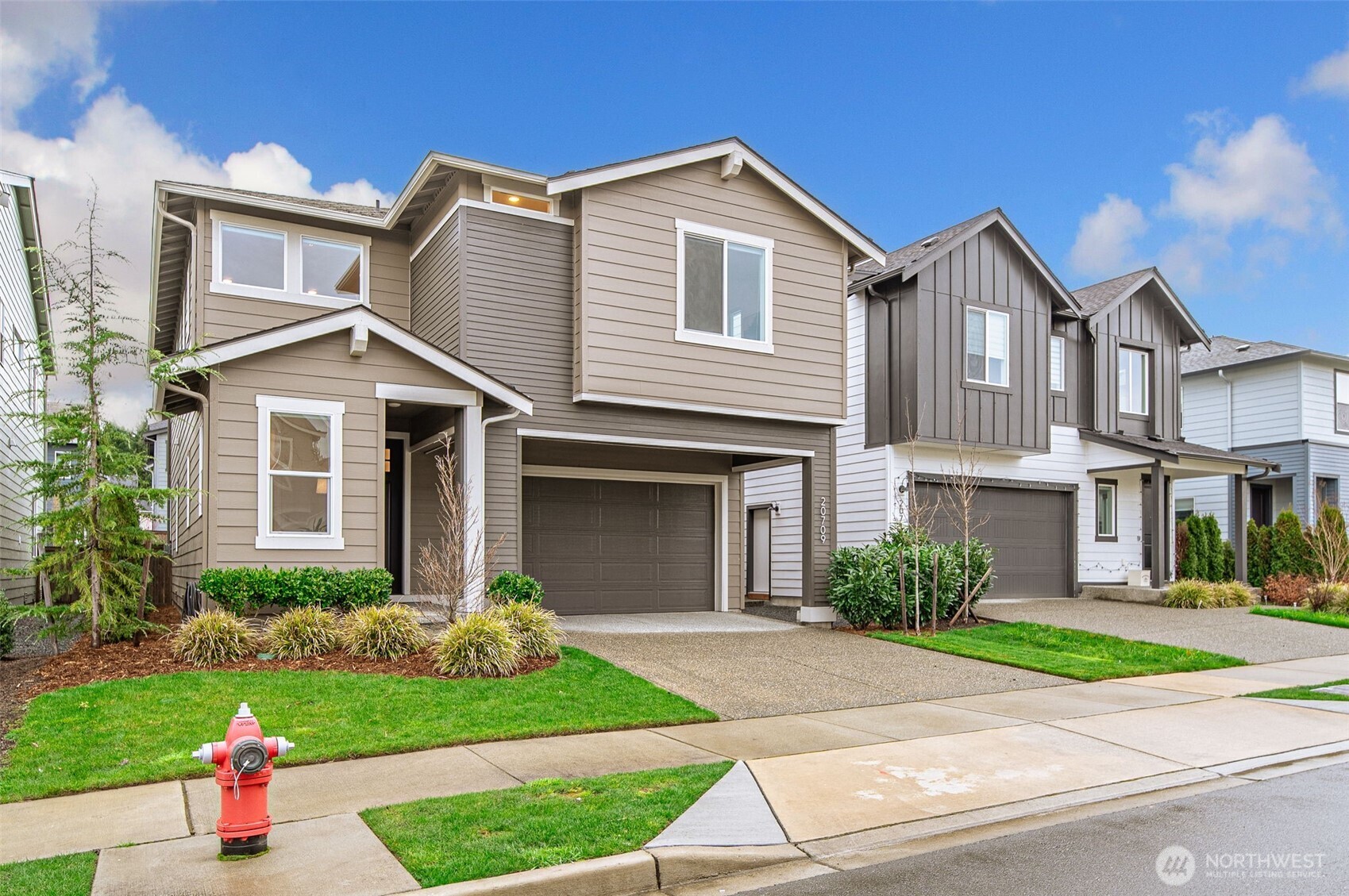 20709 137th Street Southeast Monroe, WA 98272 - Photo 2 of 40 a front view of a house with a yard and potted plants