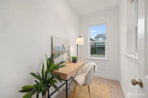 a view of a workspace with furniture