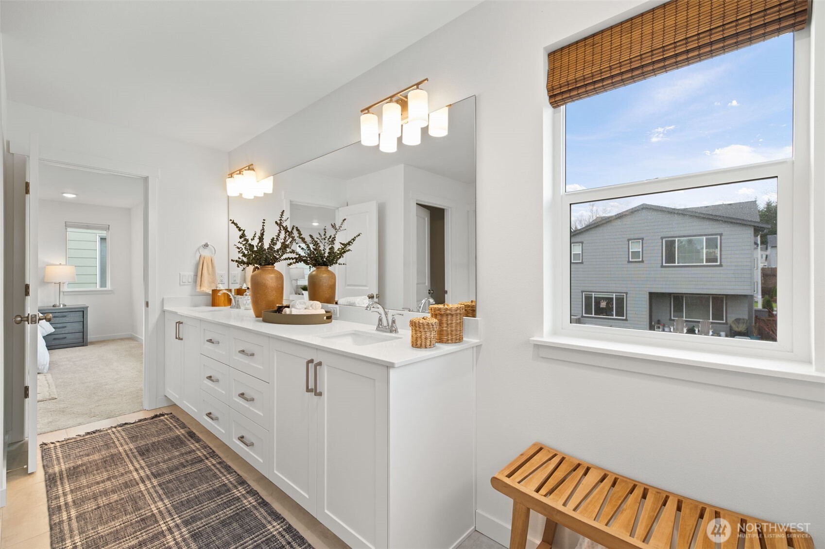 20709 137th Street Southeast Monroe, WA 98272 - Photo 27 of 40 a bathroom with a sink a mirror and a vanity
