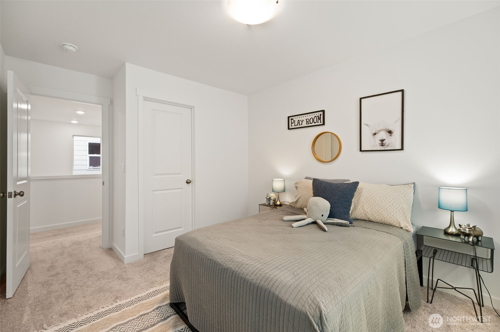 20709 137th Street Southeast Monroe, WA 98272 - Photo 30 of 40 a bedroom with a bed and lamp