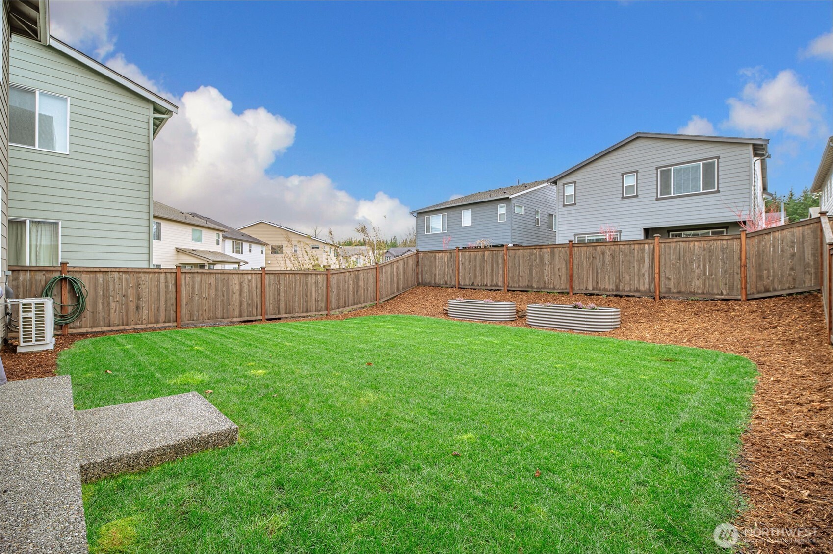 20709 137th Street Southeast Monroe, WA 98272 - Photo 36 of 40 a view of a backyard with a garden and deck