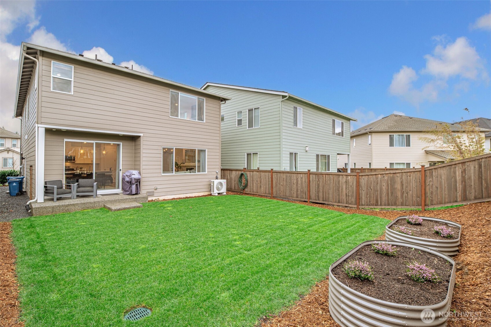 20709 137th Street Southeast Monroe, WA 98272 - Photo 37 of 40 a backyard of a house with table and chairs