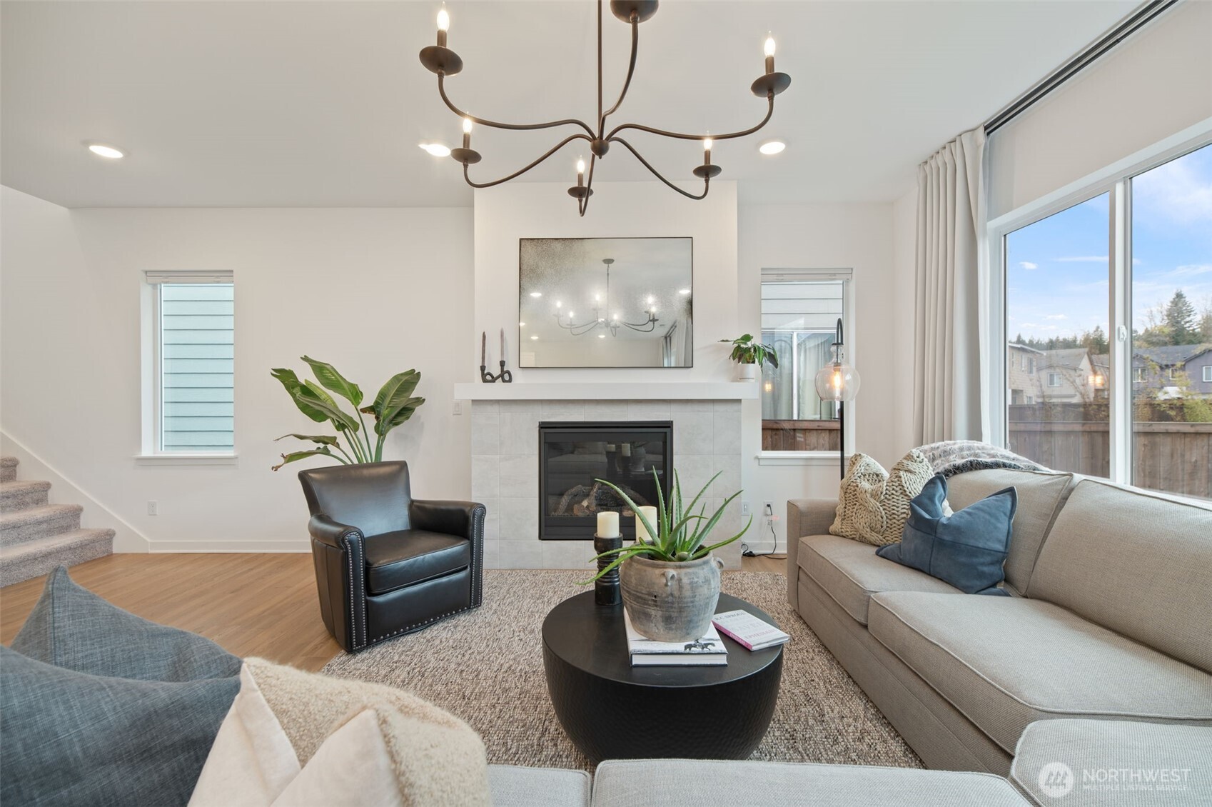 20709 137th Street Southeast Monroe, WA 98272 - Photo 8 of 40 a living room with furniture a fireplace and a table
