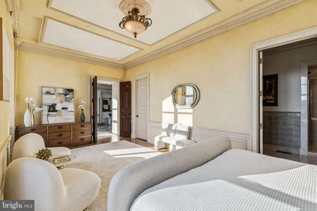 a bathroom with a double vanity sink mirror and bathtub