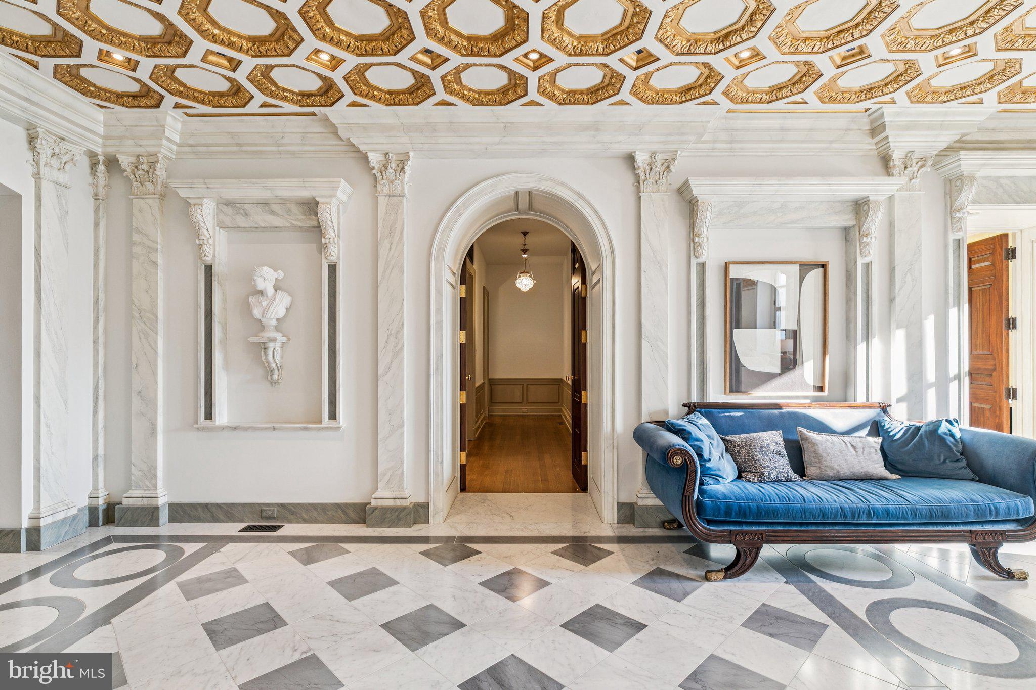421 Chestnut Street, Unit 401 Philadelphia, PA 19106 - Photo 22 of 36 a living room with a couch and a table with wooden floor