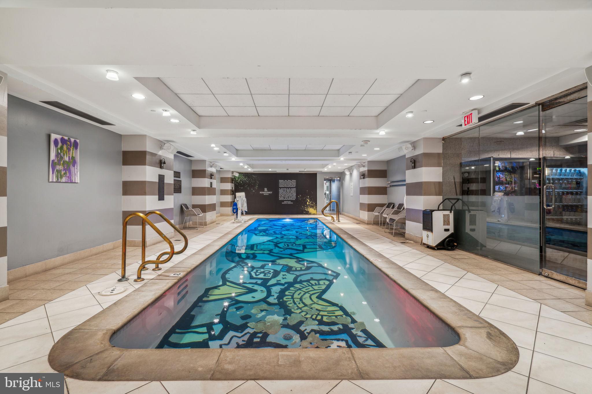 421 Chestnut Street, Unit 401 Philadelphia, PA 19106 - Photo 30 of 36 a living room with lots of furniture and a large window