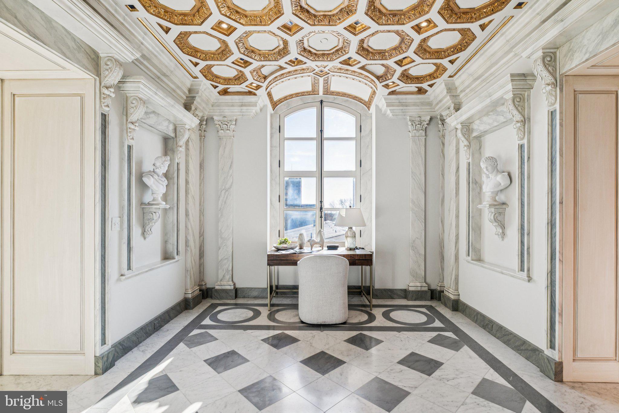 421 Chestnut Street, Unit 401 Philadelphia, PA 19106 - Photo 4 of 36 a living room with a black white checkered floor next to a window and a rug