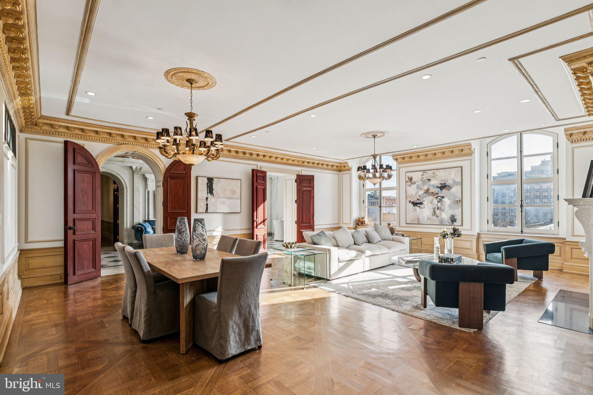 421 Chestnut Street, Unit 401 Philadelphia, PA 19106 - Photo 6 of 36 a living room with fireplace furniture and a chandelier