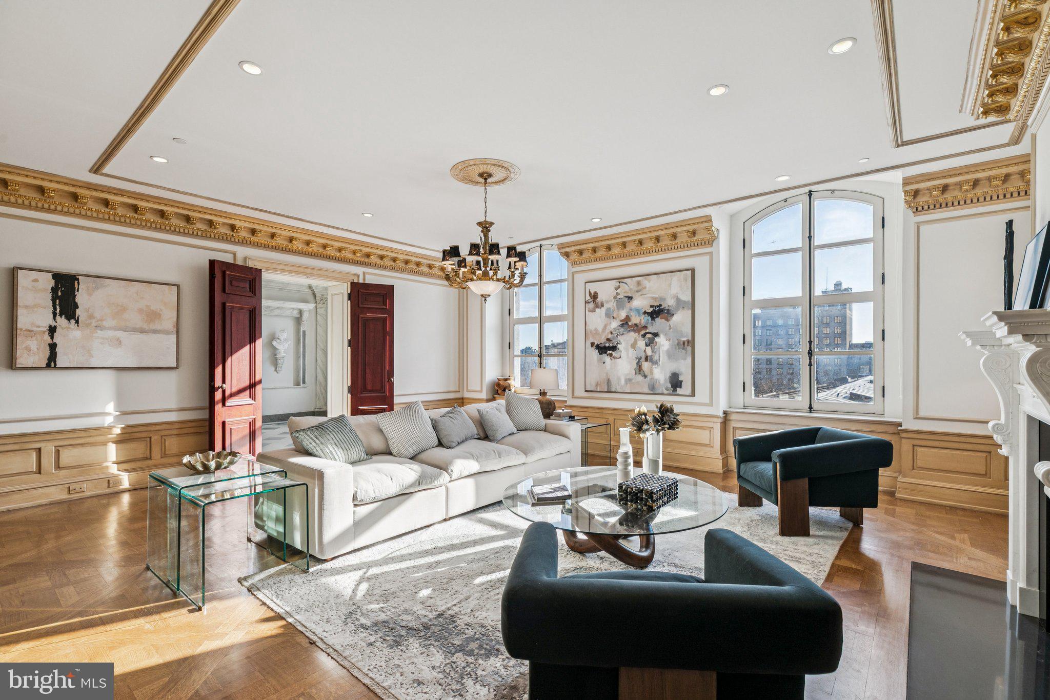 421 Chestnut Street, Unit 401 Philadelphia, PA 19106 - Photo 8 of 36 a living room with fireplace furniture and a large window
