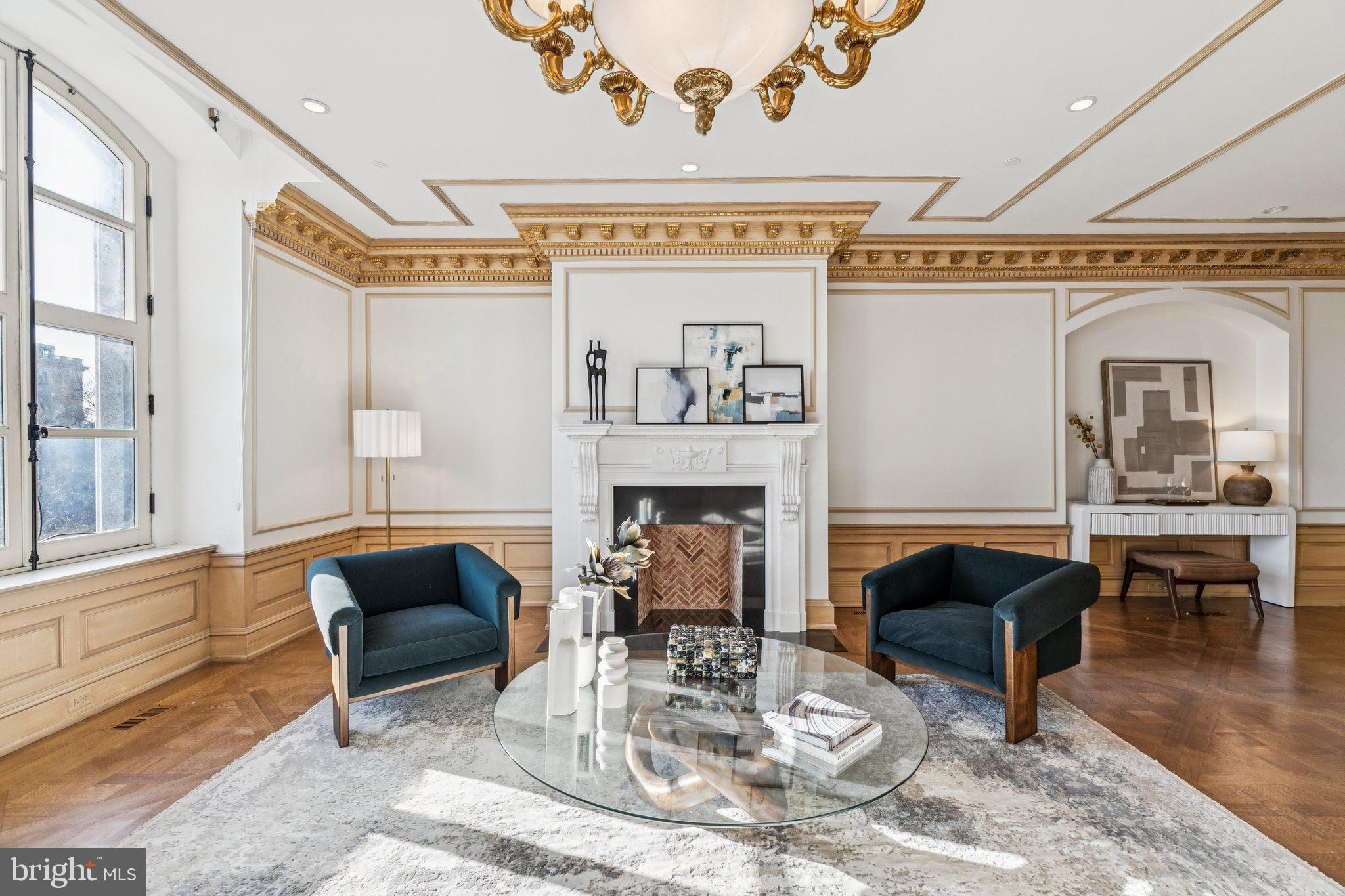 421 Chestnut Street, Unit 401 Philadelphia, PA 19106 - Photo 9 of 36 a living room with furniture a fireplace and a table