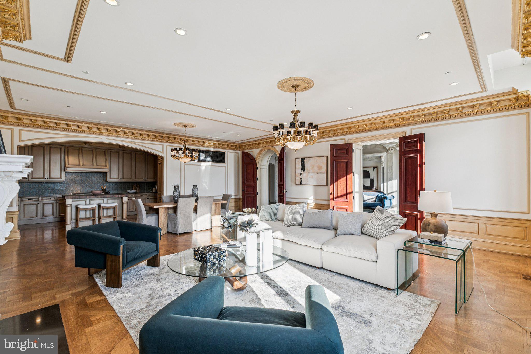 421 Chestnut Street, Unit 401 Philadelphia, PA 19106 - Photo 10 of 36 a living room with furniture and a chandelier