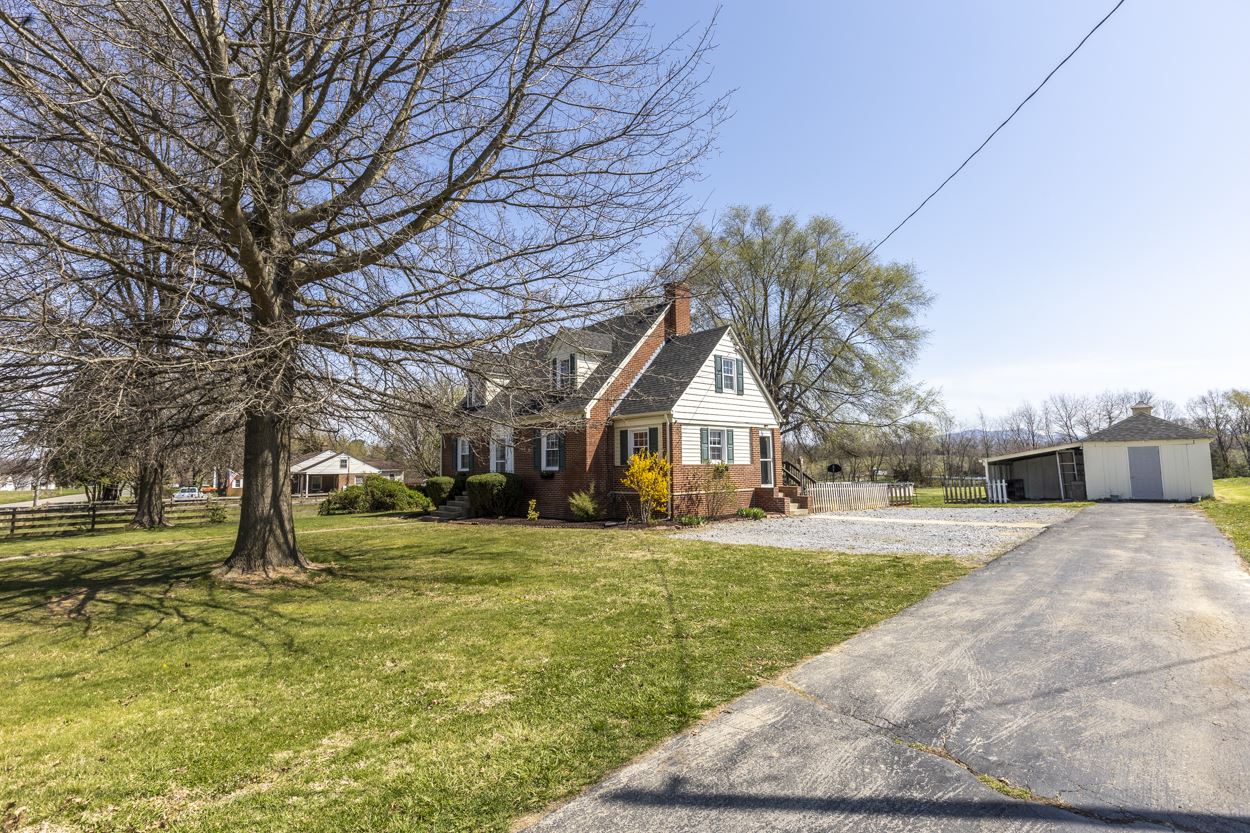 713 Battlefield Road Fort Defiance, VA 24437 - Photo 2 of 47 a view of a house with a yard and garage
