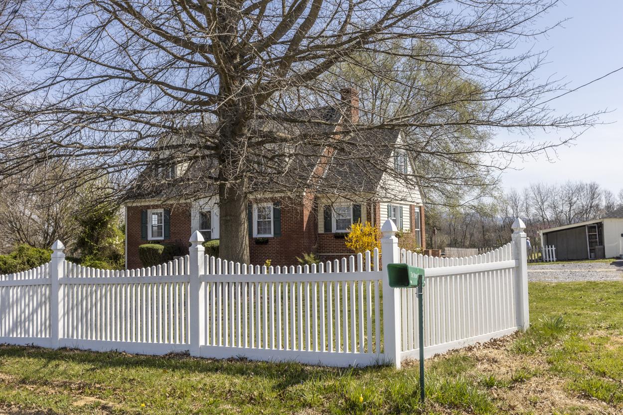 713 Battlefield Road Fort Defiance, VA 24437 - Photo 3 of 47 a view of a house with a small yard and wooden fence