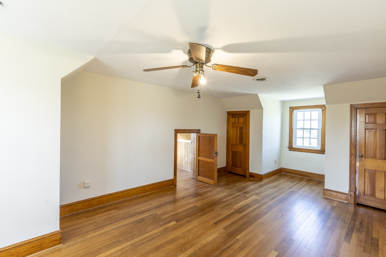 713 Battlefield Road Fort Defiance, VA 24437 - Photo 38 of 47 a view of a livingroom with wooden floor and a ceiling fan