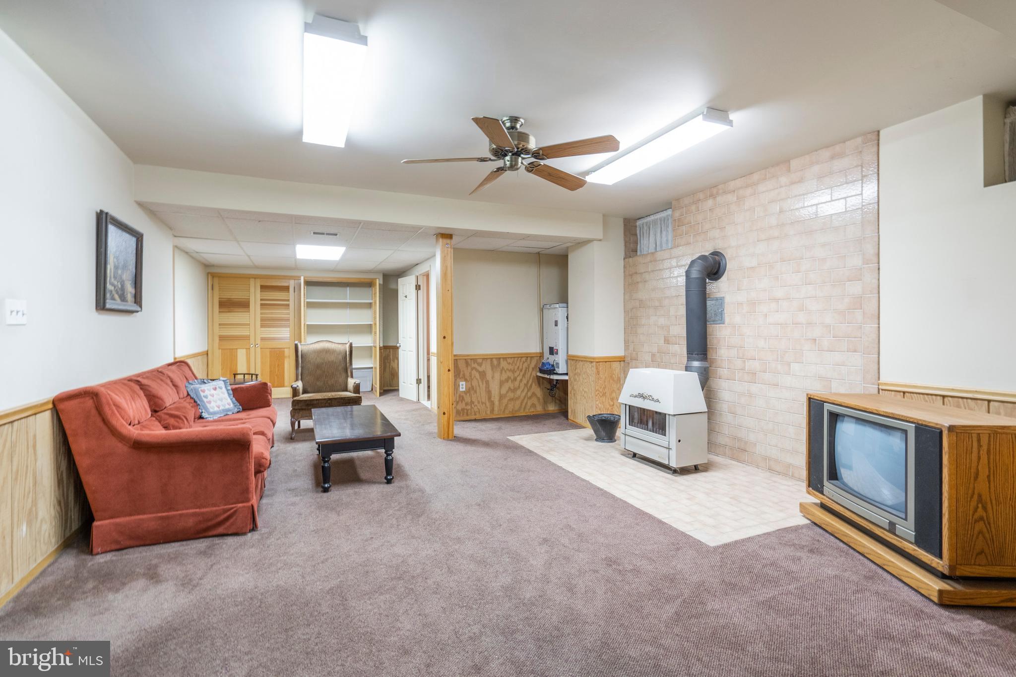 14 Highfield Lane Wayne, PA 19087 - Photo 34 of 42 Finished Basement with Coal Stove