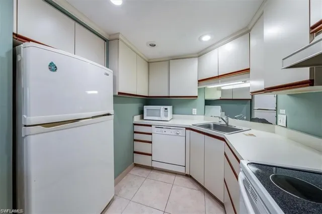 a kitchen with a stove and a refrigerator