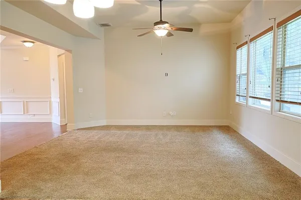 a kitchen with granite countertop wooden cabinets stainless steel appliances and a counter space