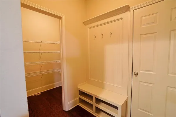a kitchen with stainless steel appliances granite countertop a refrigerator a sink and a stove
