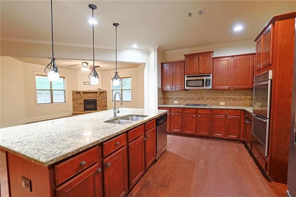 a view of kitchen with furniture and wooden floor