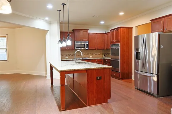wooden floor in an empty room with a fireplace