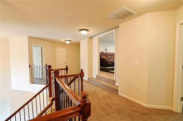 a view of a livingroom with a ceiling fan and window