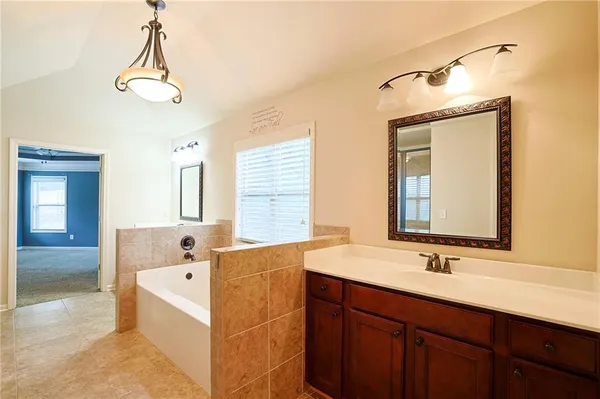 an empty room with a ceiling fan and a window