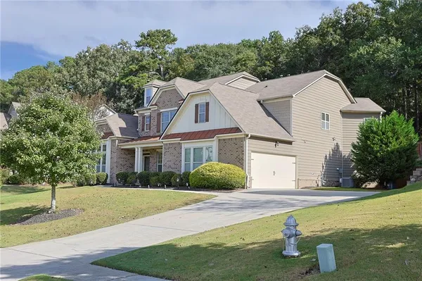 a front view of a house with garden