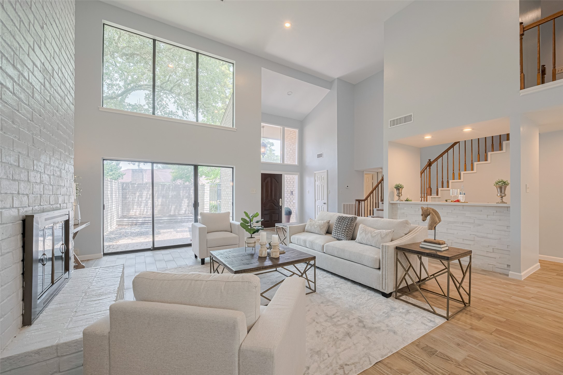 What a beautiful view of the space! In the background you can see the handsome wet bar with space for barstools.
