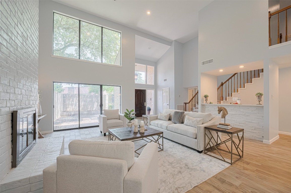 What a beautiful view of the space! In the background you can see the handsome wet bar with space for barstools.