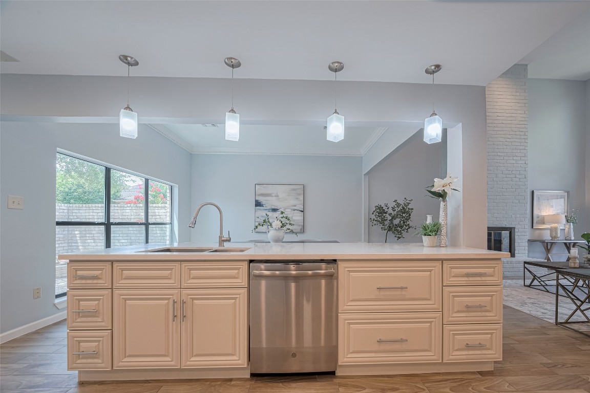 15600 Barkers Landing Road, Unit 20 Houston, TX 77079 - Photo 12 of 49 Bright, modern kitchen with a large island, pendant lighting, and light cabinetry.