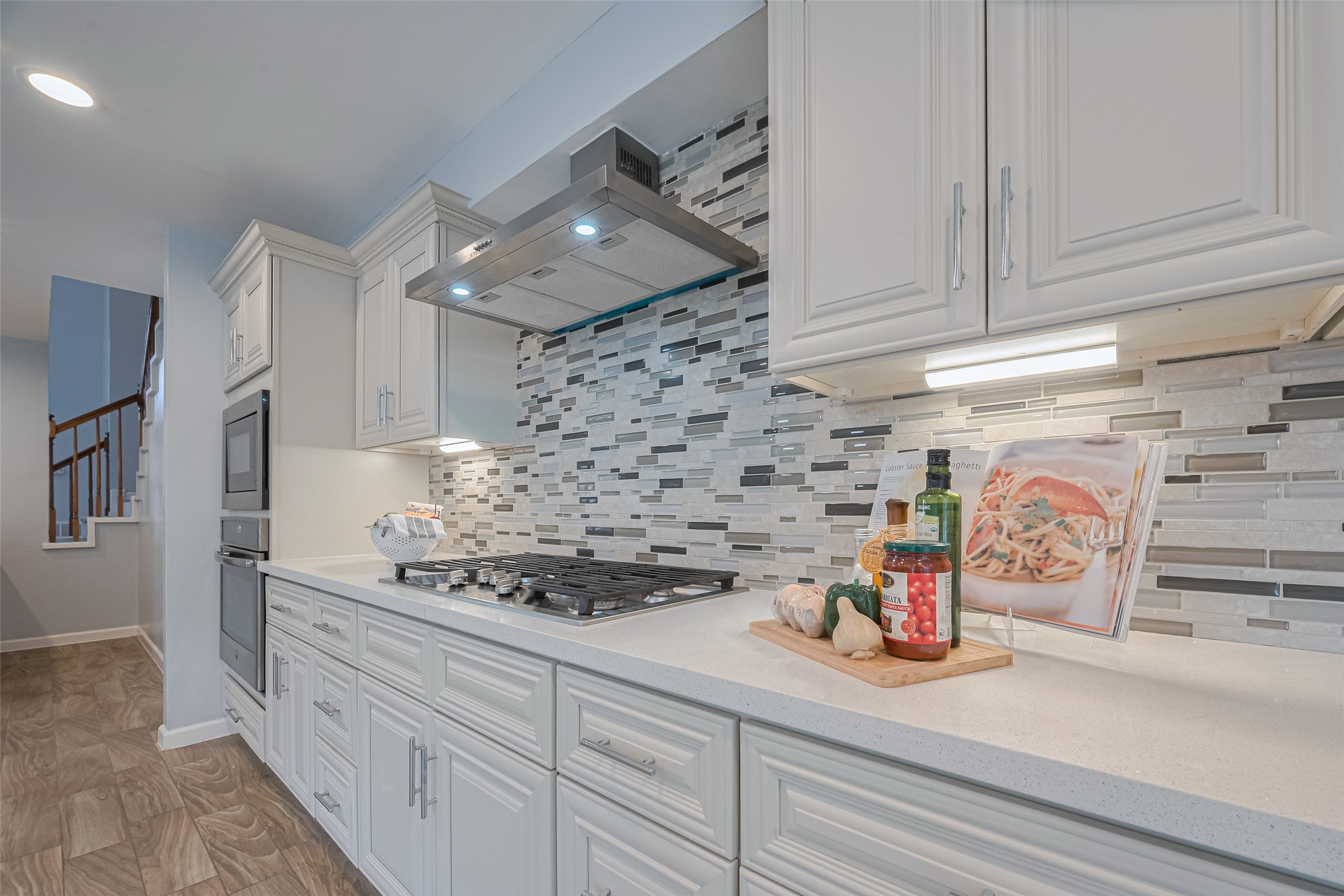 15600 Barkers Landing Road, Unit 20 Houston, TX 77079 - Photo 15 of 49 The countertop provides ample workspace, complemented by under-cabinet lighting for a bright and inviting atmosphere. Imagine yourself preparing family dinners in this modern kitchen.