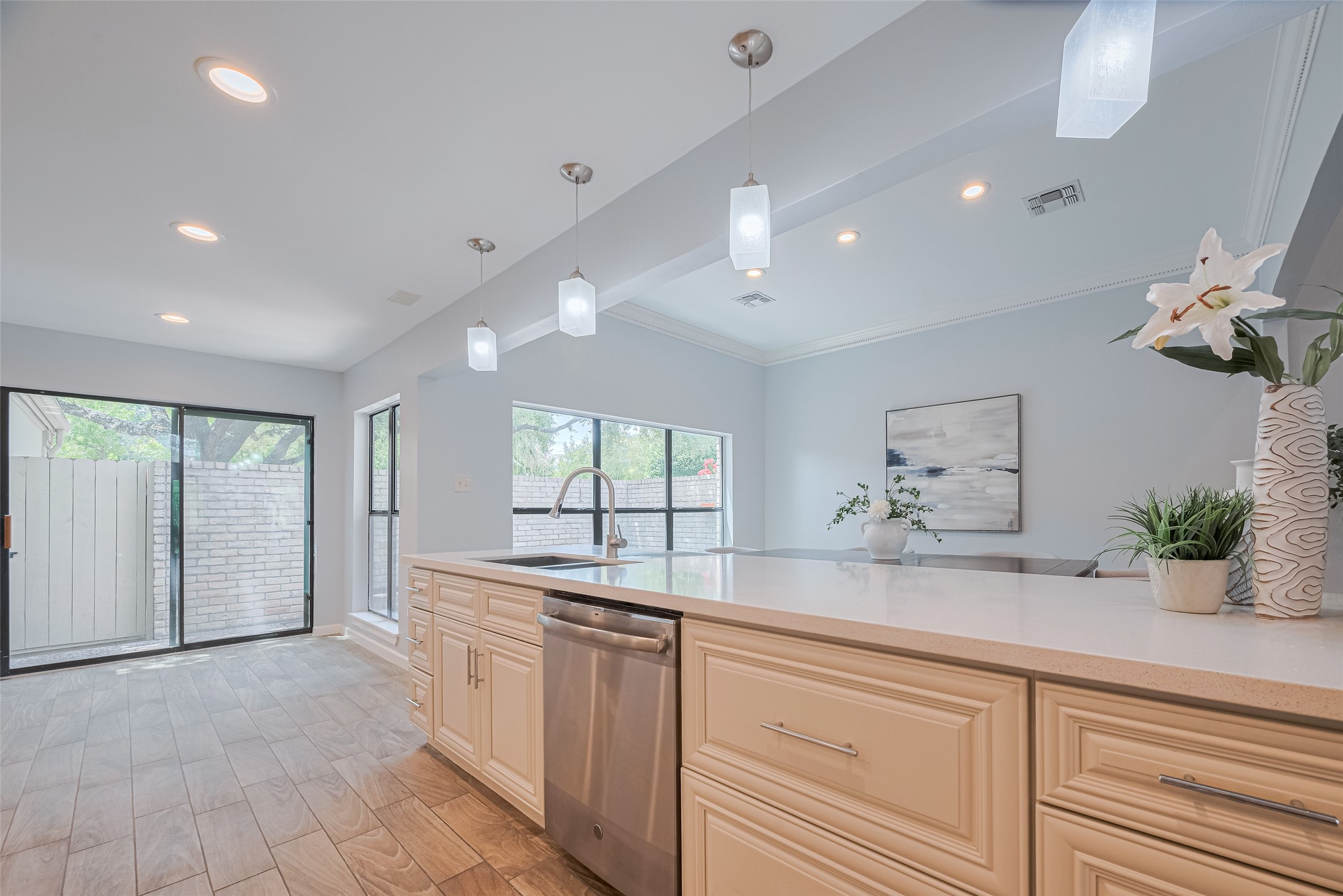 15600 Barkers Landing Road, Unit 20 Houston, TX 77079 - Photo 17 of 49 Another view of the kitchen with view of the breakfast area and sliding doors to access one of the patios outside.
