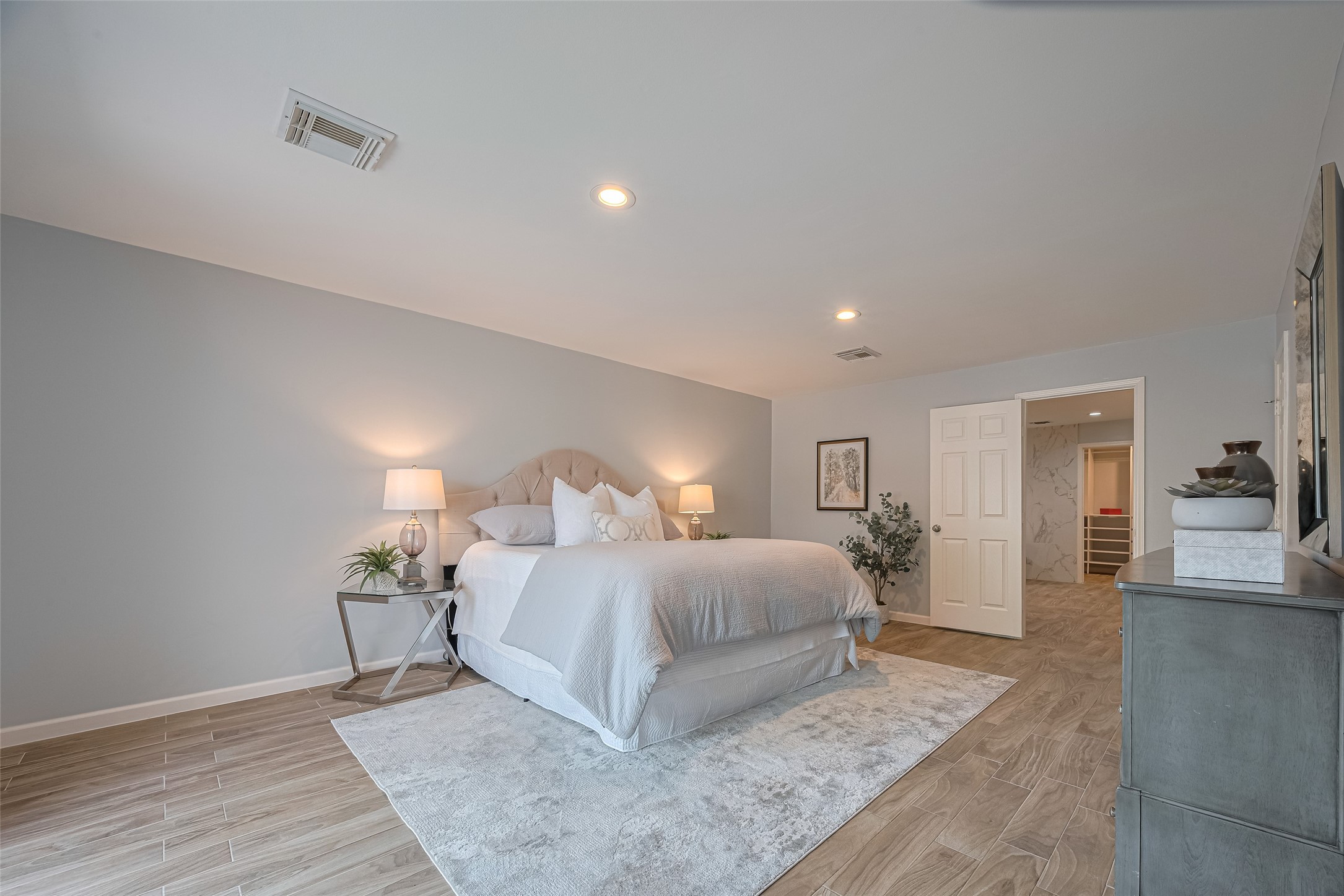15600 Barkers Landing Road, Unit 20 Houston, TX 77079 - Photo 26 of 49 The Primary Bedroom is spacious enough that can accommodate a Kind size bed and still have ample space to walk around. It's a very serene and a great space to relax after a long day.