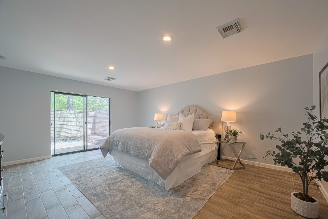 15600 Barkers Landing Road, Unit 20 Houston, TX 77079 - Photo 28 of 49 The sliding glass door opens to a private outdoor area, offering plenty of natural light and a fantastic spot to have a drink/coffee.