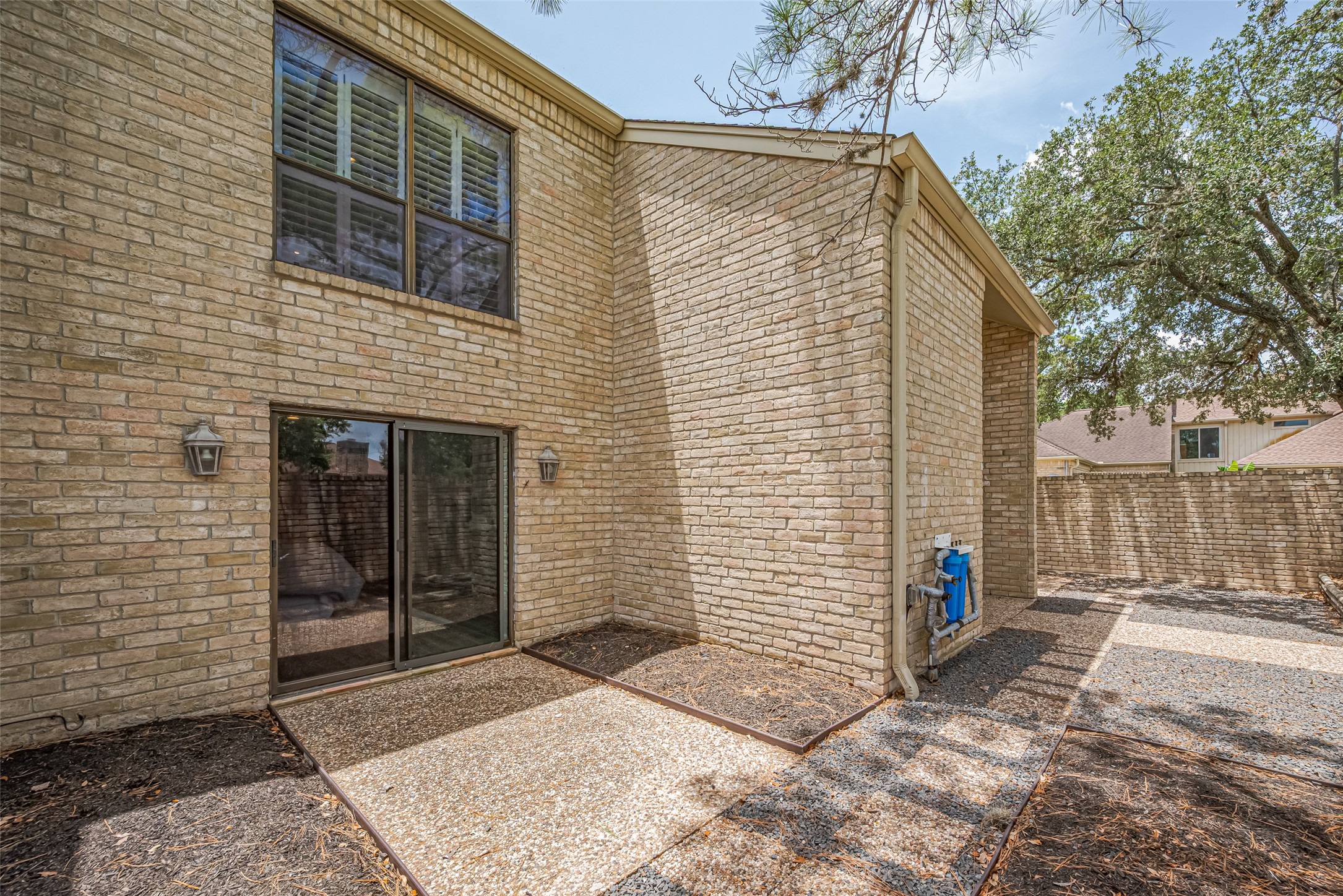 15600 Barkers Landing Road, Unit 20 Houston, TX 77079 - Photo 29 of 49 This is the patio area outside the Primary Bedroom. It is surrounded by brick walls for privacy.