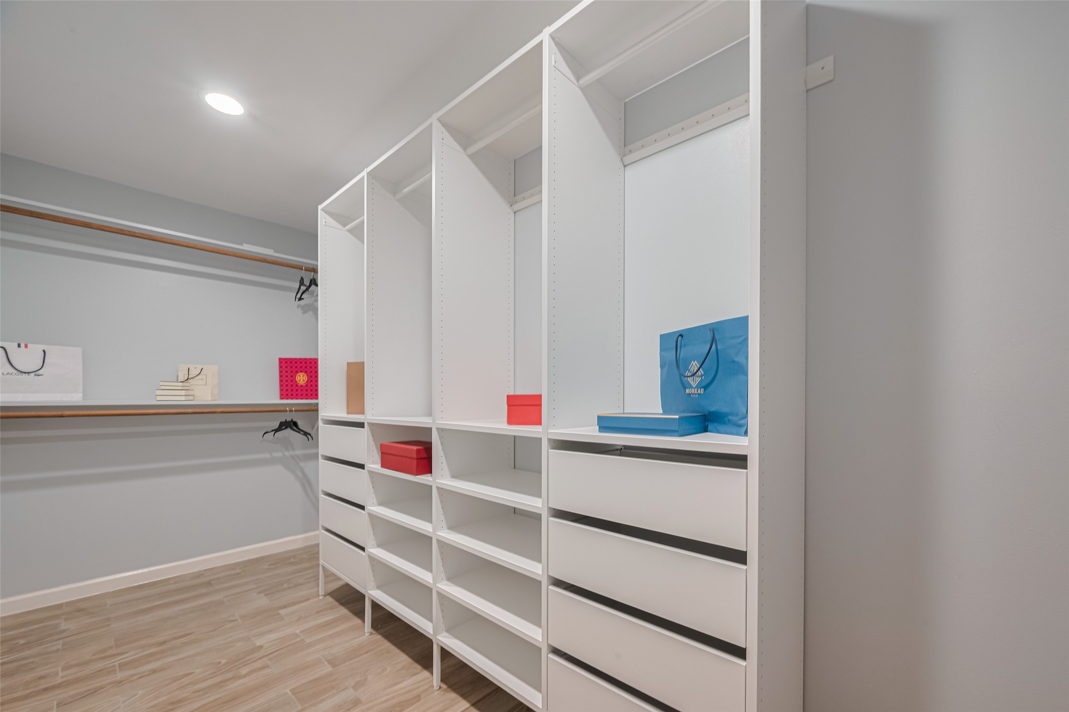 15600 Barkers Landing Road, Unit 20 Houston, TX 77079 - Photo 35 of 49 This spacious walk-in closet features custom shelving and drawers, ample hanging space, and a sleek, modern design. Perfect for organized storage.